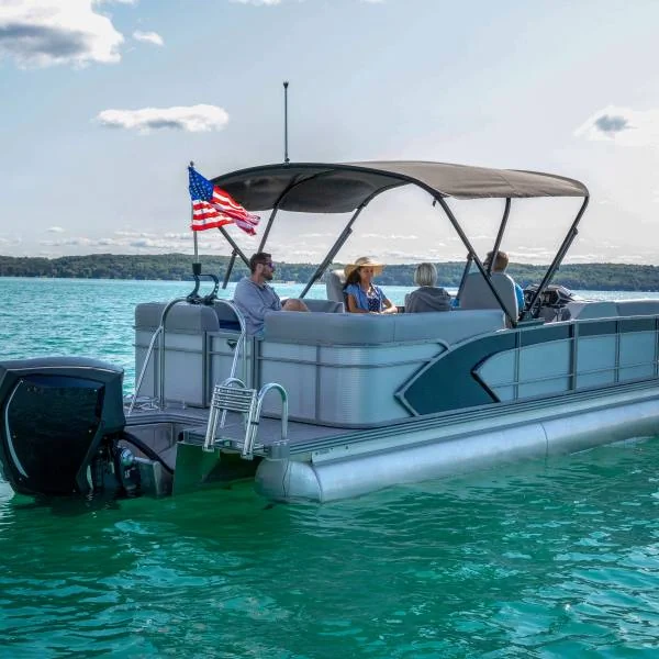 Boaters enjoying the extra shade of the SureShade Power Bimini Top 