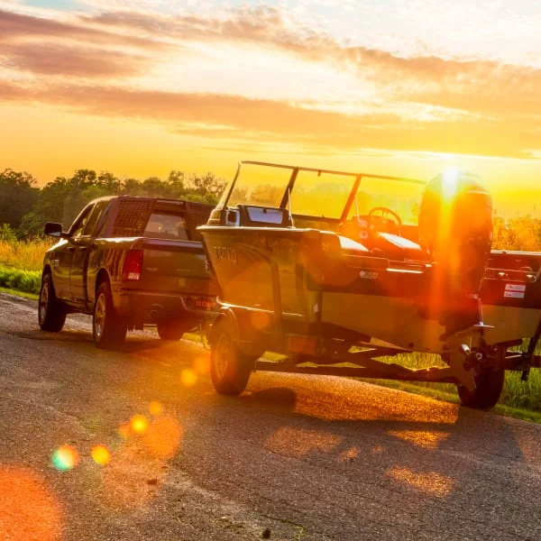 Pickup Truck Towing Boat on Trailer