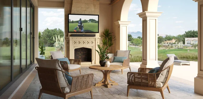 Furrion Outdoor TV on a Patio with Comfortable Chairs and an Outdoor Fireplace