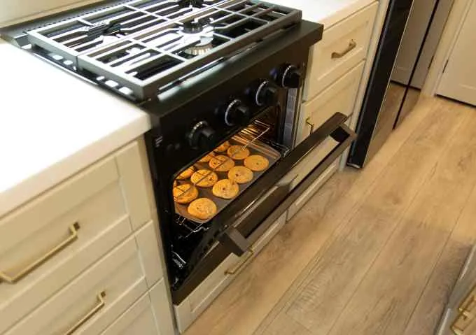 RV range replacement parts. RV oven with cookies.