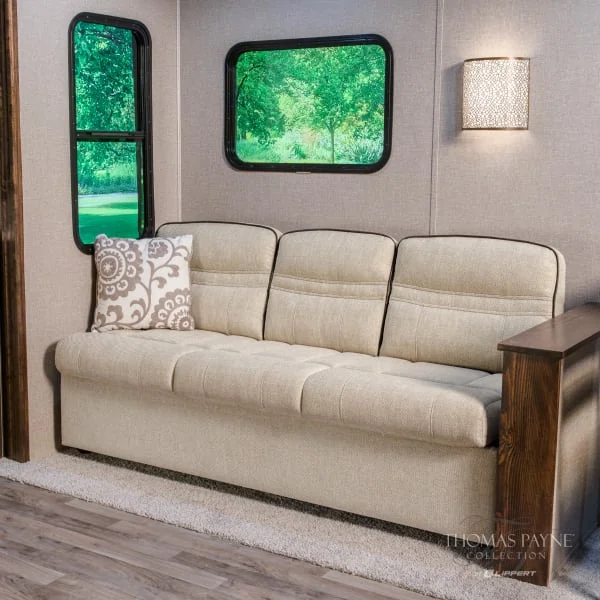 Cream-colored RV jackknife sofa