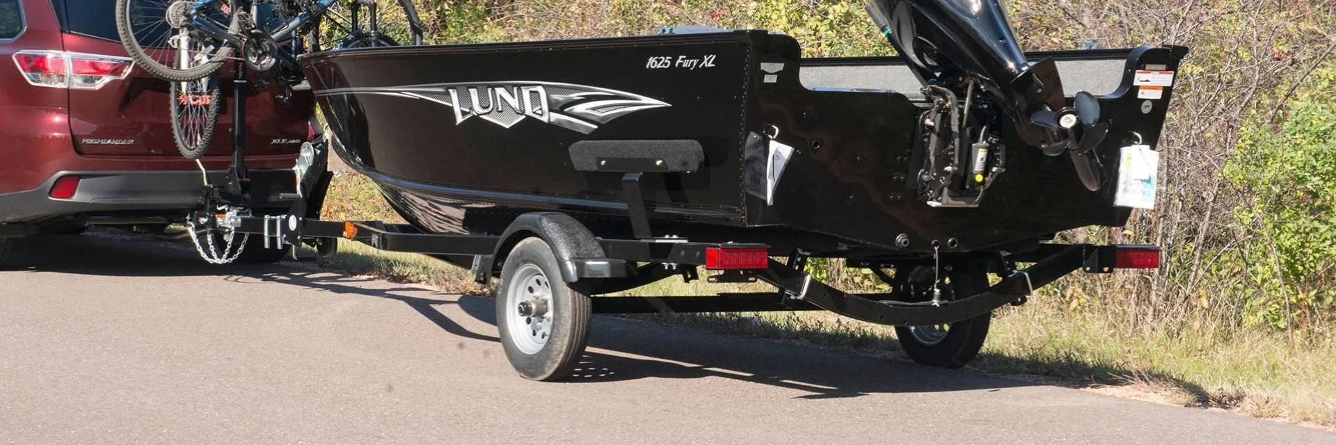 Car Pulling Boat on Trailer with Boat Trailer Lights