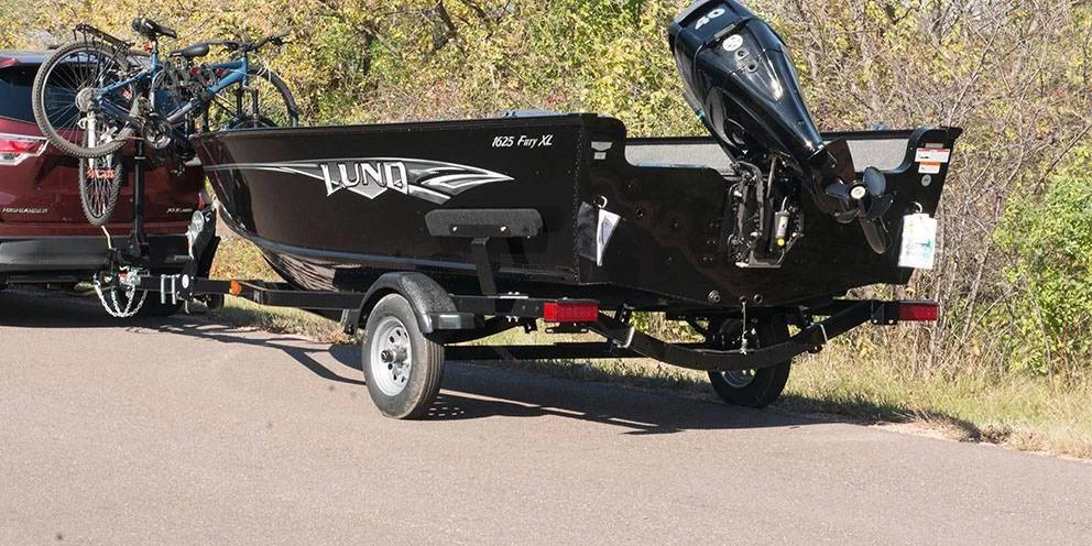 Car Pulling Boat on Trailer with Boat Trailer Lights