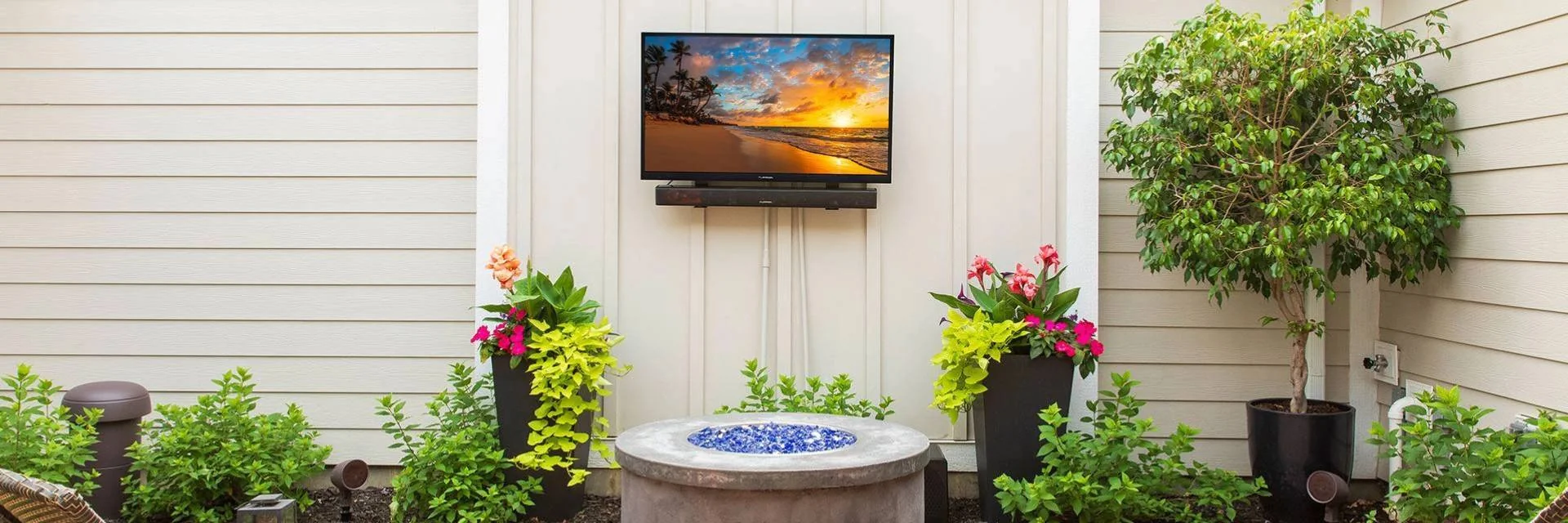 Outdoor TV and Outdoor Speaker on Patio with Outdoor Furniture and Outdoor Firepit