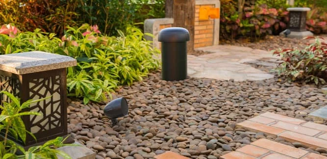 Furrion Landscape Speaker System in a Backyard Rock Garden