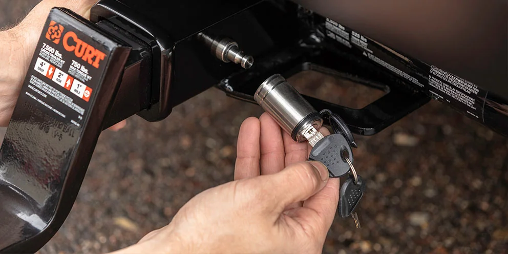 CURT trailer hitch pins and locks secure your trailer and prevent theft.