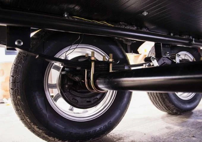 Trailer leaf springs, axle hangers, and hardware