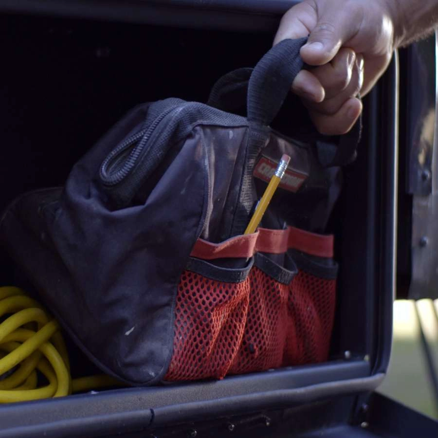 Person pulling a tool bag out of the Solid Step storage box