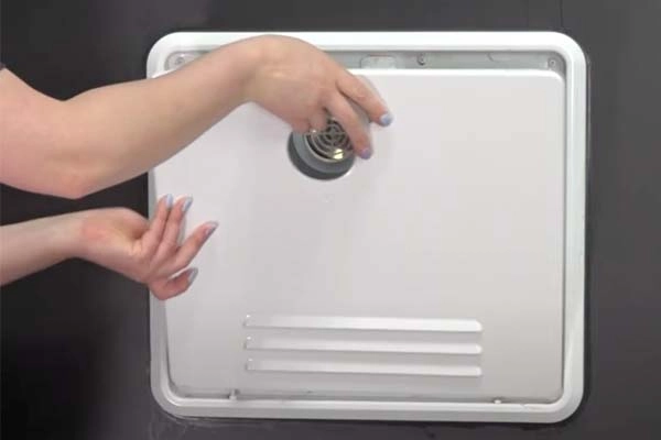 Remove water heater door from assembly