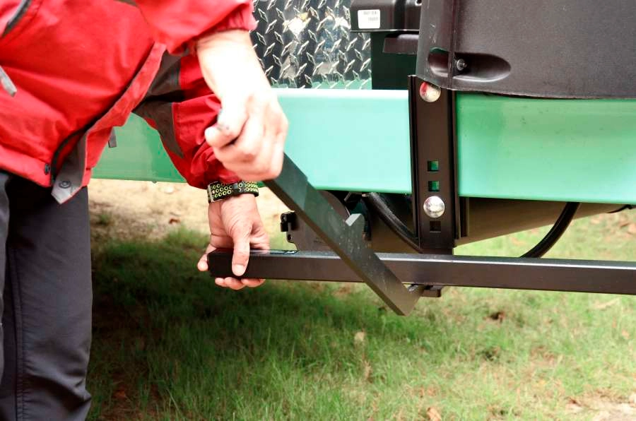 Person setting up weight distribution hitches for trailering